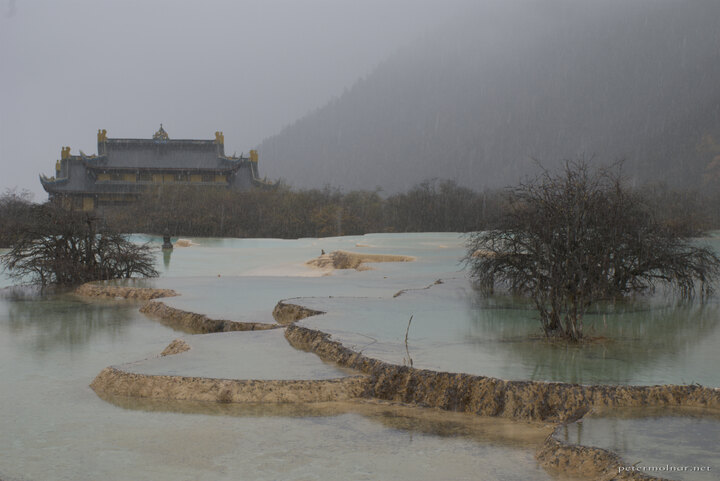 Ancient temple in Huanglong with
pond